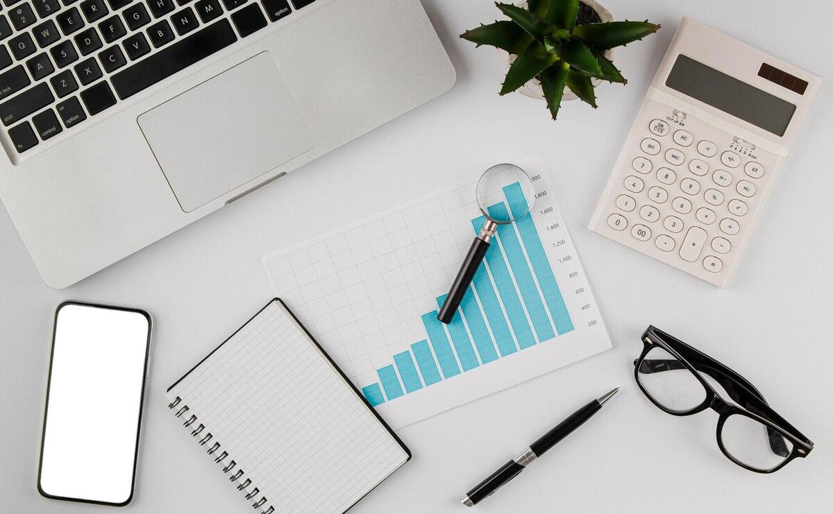 Top view of office desk with growth chart