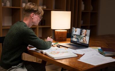 Young man learning in a virtual classroom