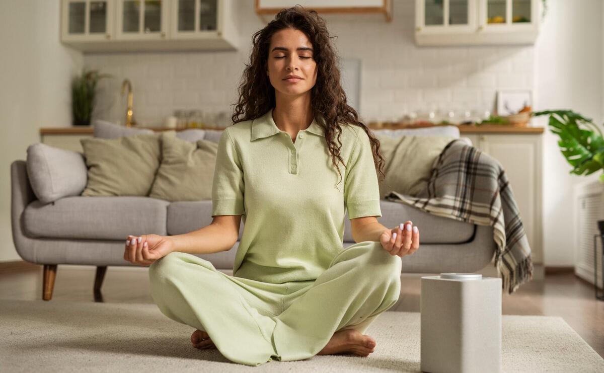 Woman meditating at home.