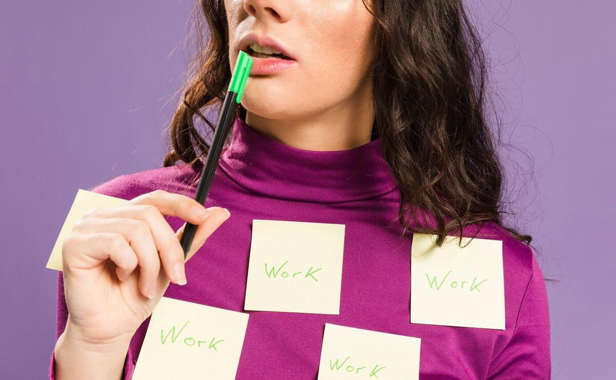 Close-up sticky notes with word "work" written on them