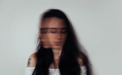 A picture of a woman with blurred movement.