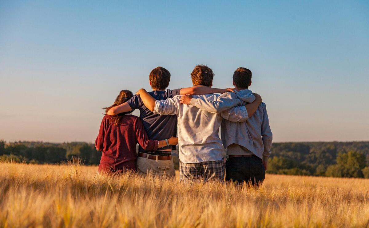 unknown persons standing outdoors