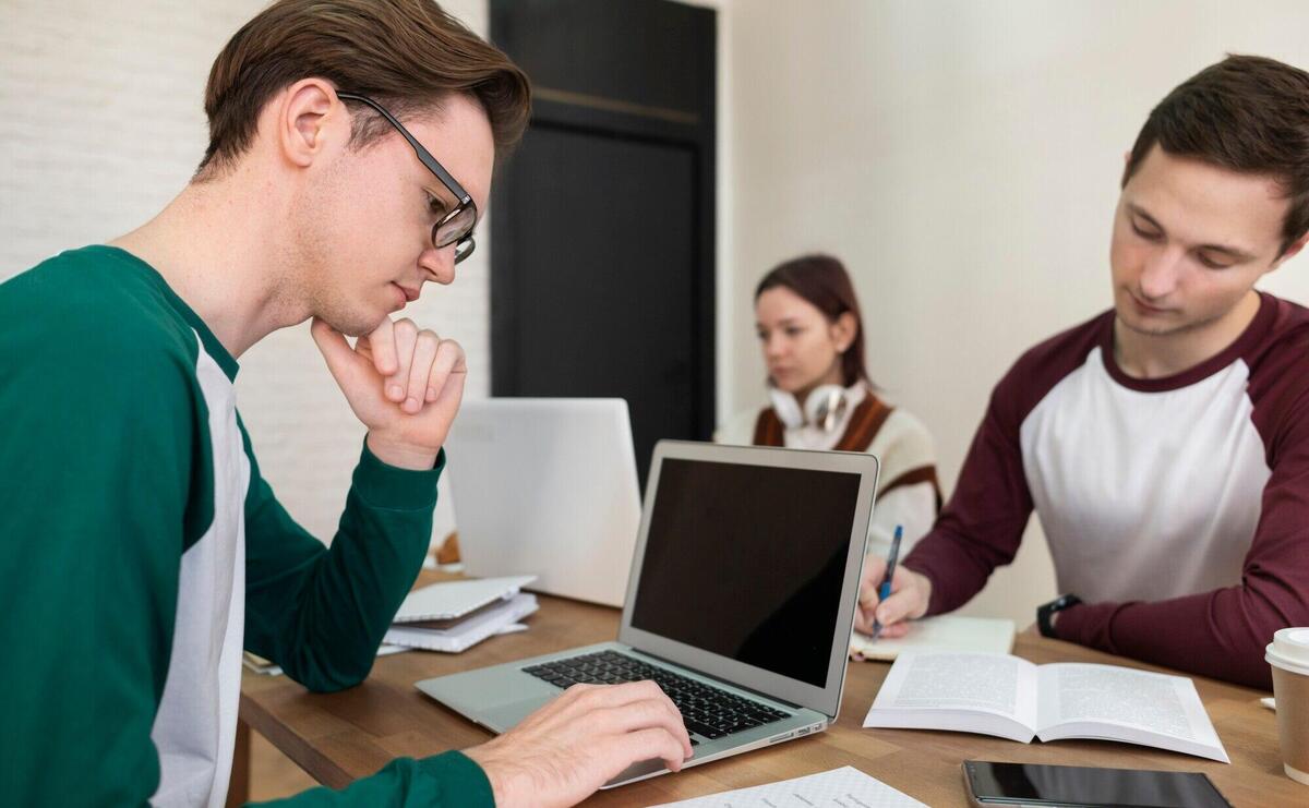 Classmates learning together in group study session