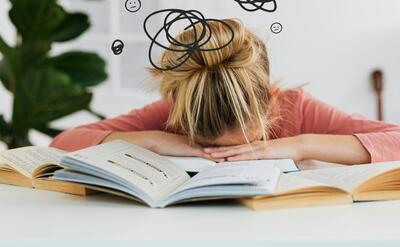 Woman Putting Her Head Down on the Desk