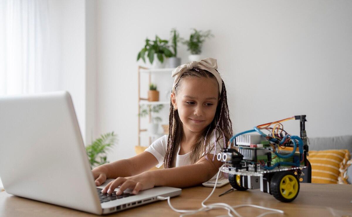 Adorable girl being passionate about robotics