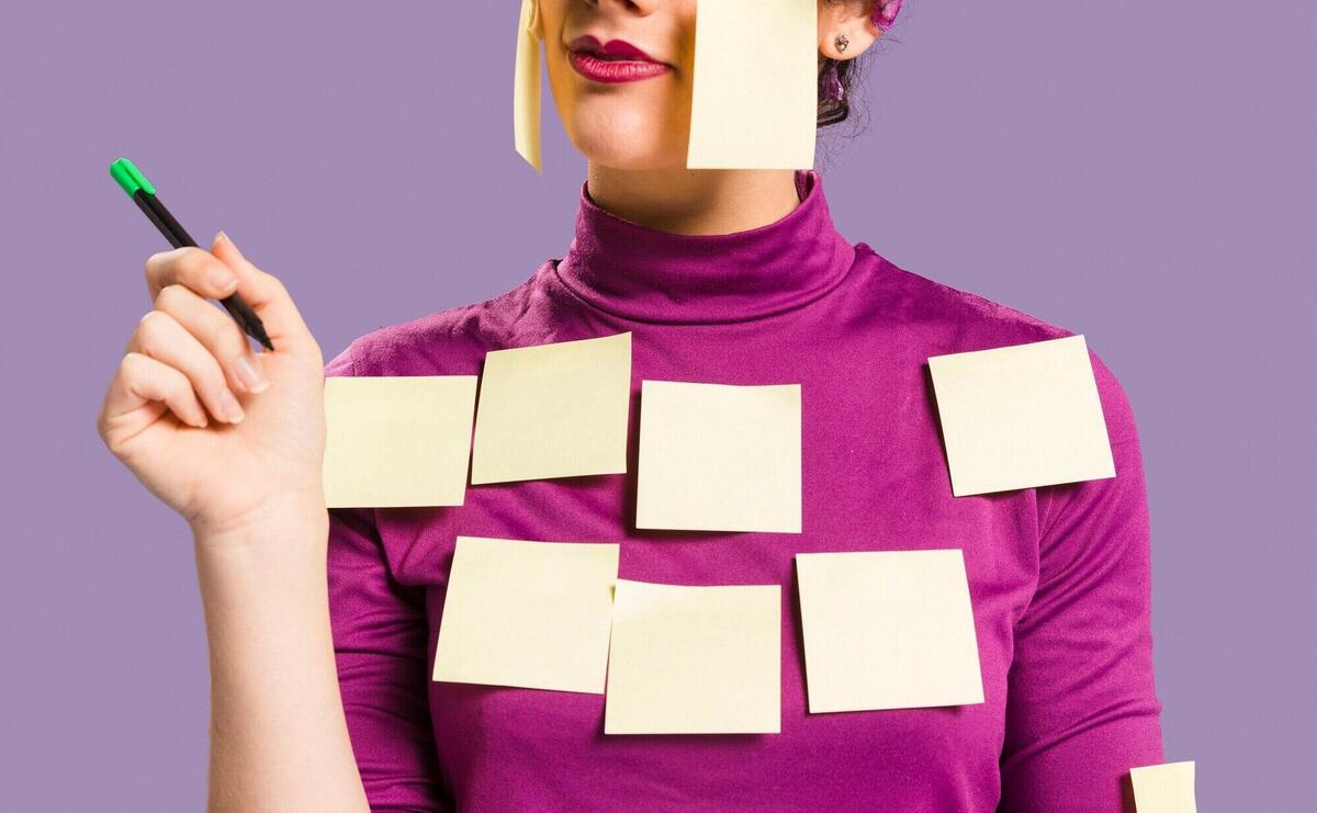 Woman with sticky empty notes on her