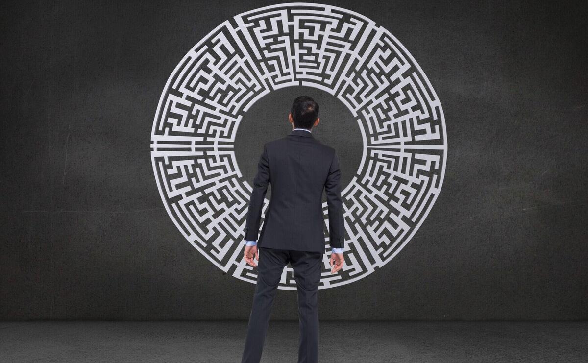 Rear view of businessman looking a maze