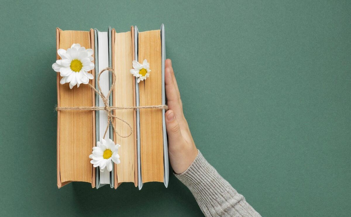 Composition with books and flower.