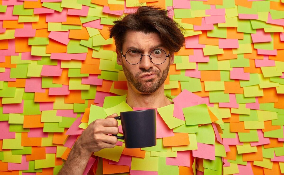 Close up on young student surrounded by sticky notes