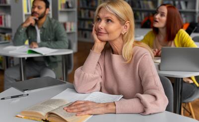 Medium shot adults studying together