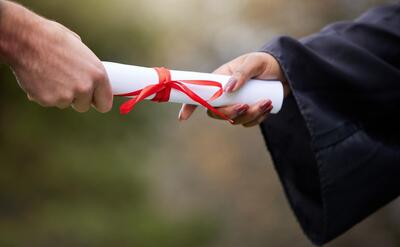 Cropped hand of woman holding gift