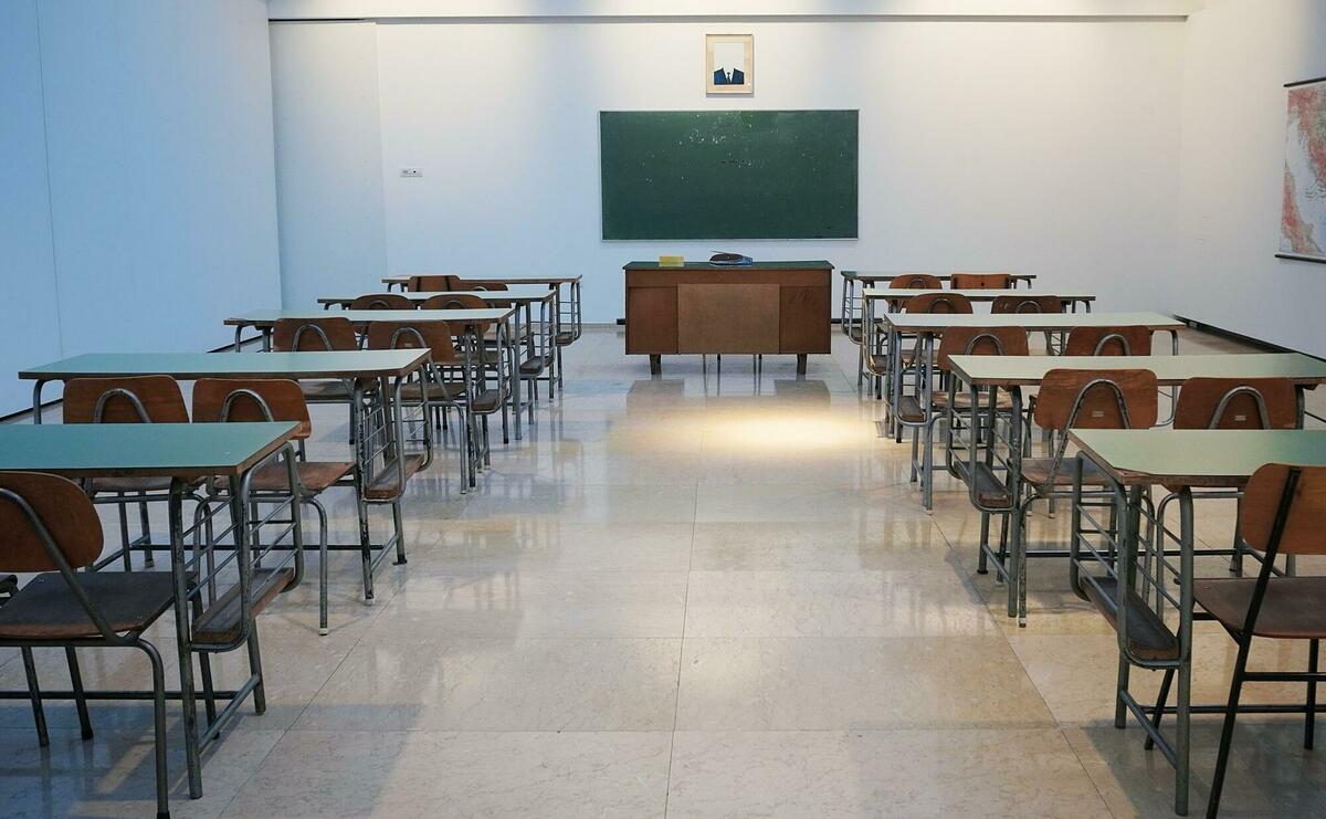 Empty classroom with tables and chairs