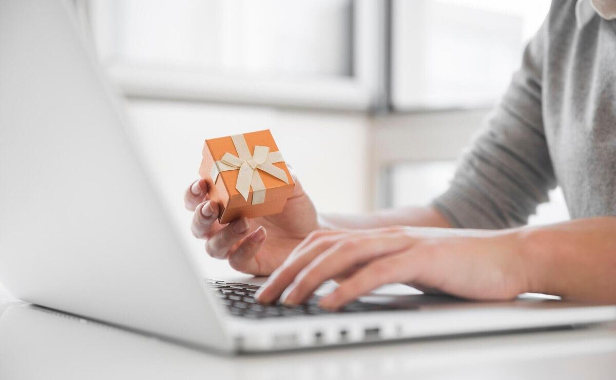 Woman sitting at table with laptop