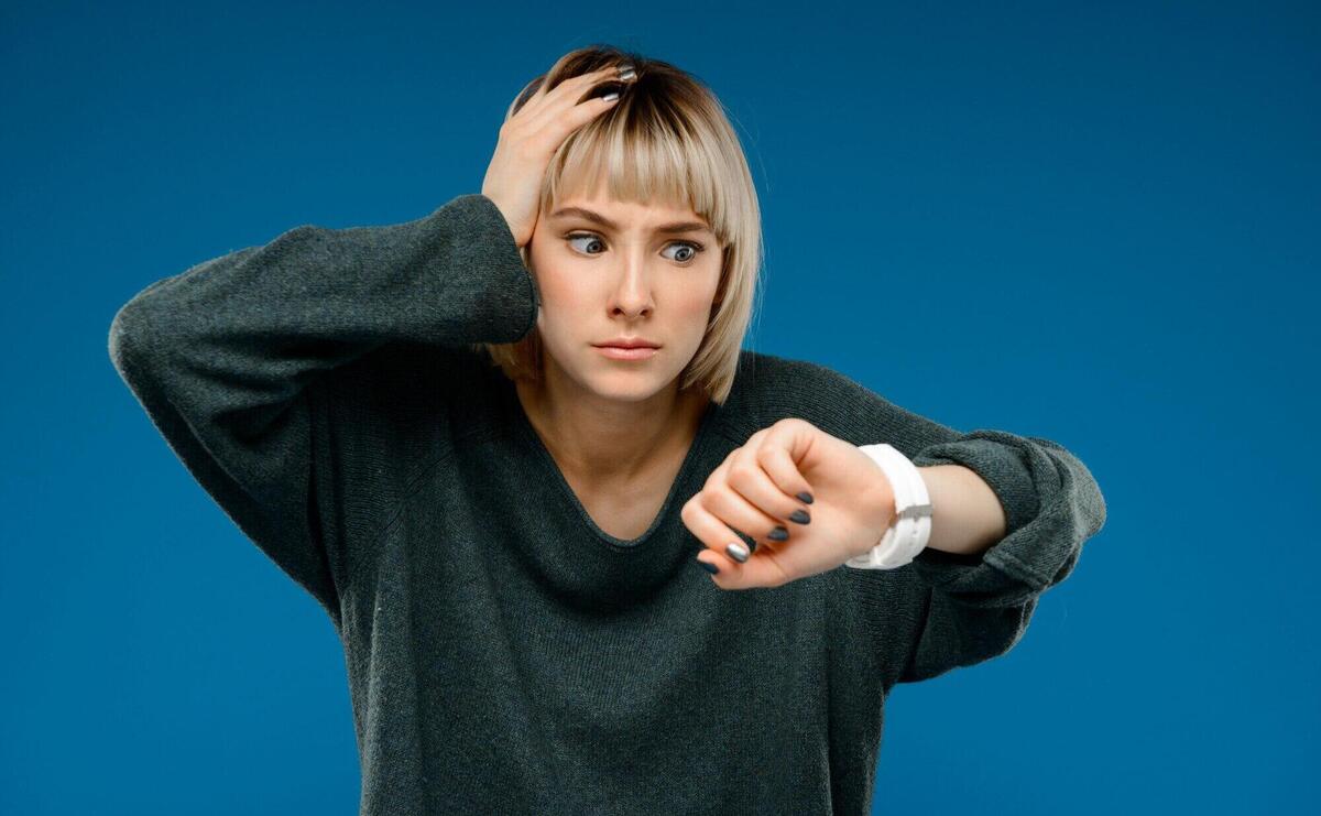 Portrait of young woman over blue wall