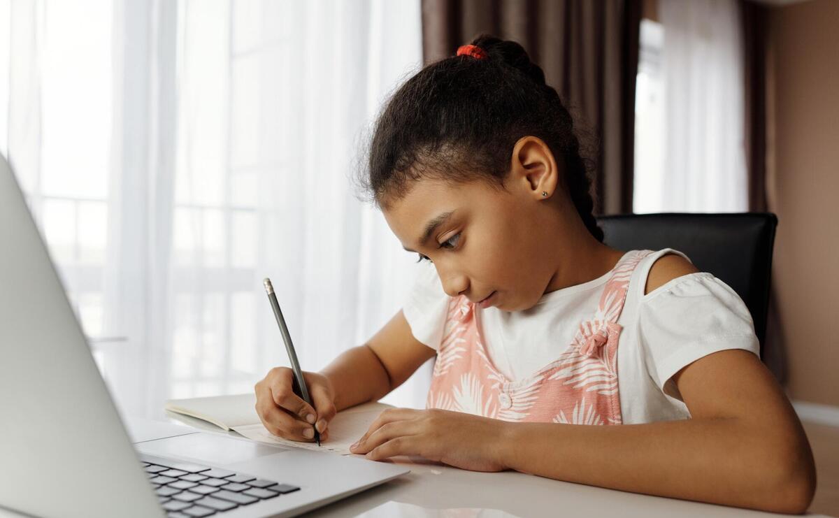 Little girl taking online classes