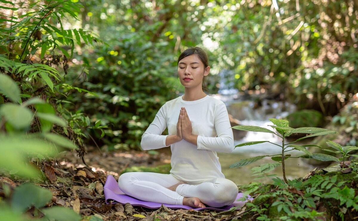 Beautiful girls are playing yoga at the park