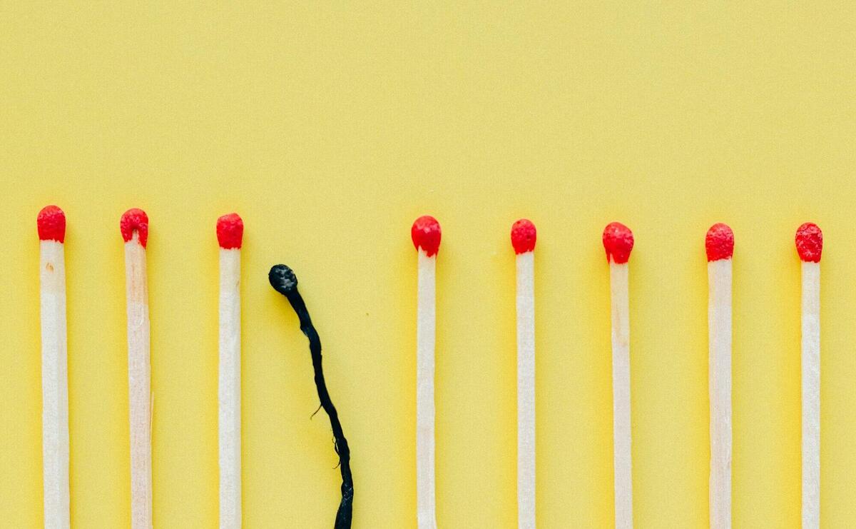 White and Red Candles on White Surface