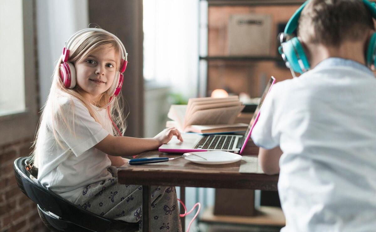 Technology concept with two kids at table