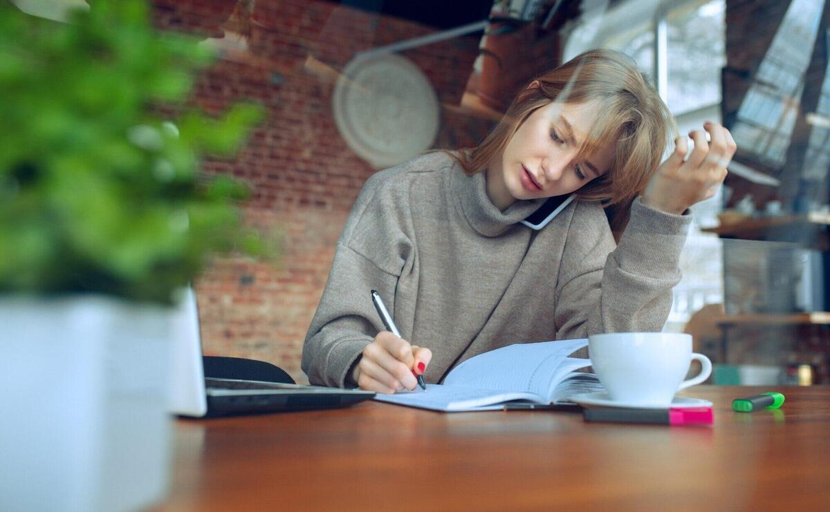 Beautiful caucasian business lady working in office with laptop