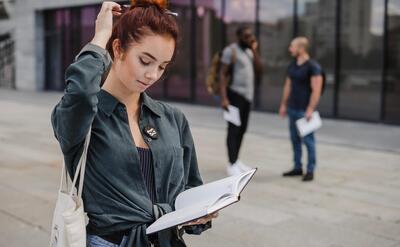 Puzzled woman with book