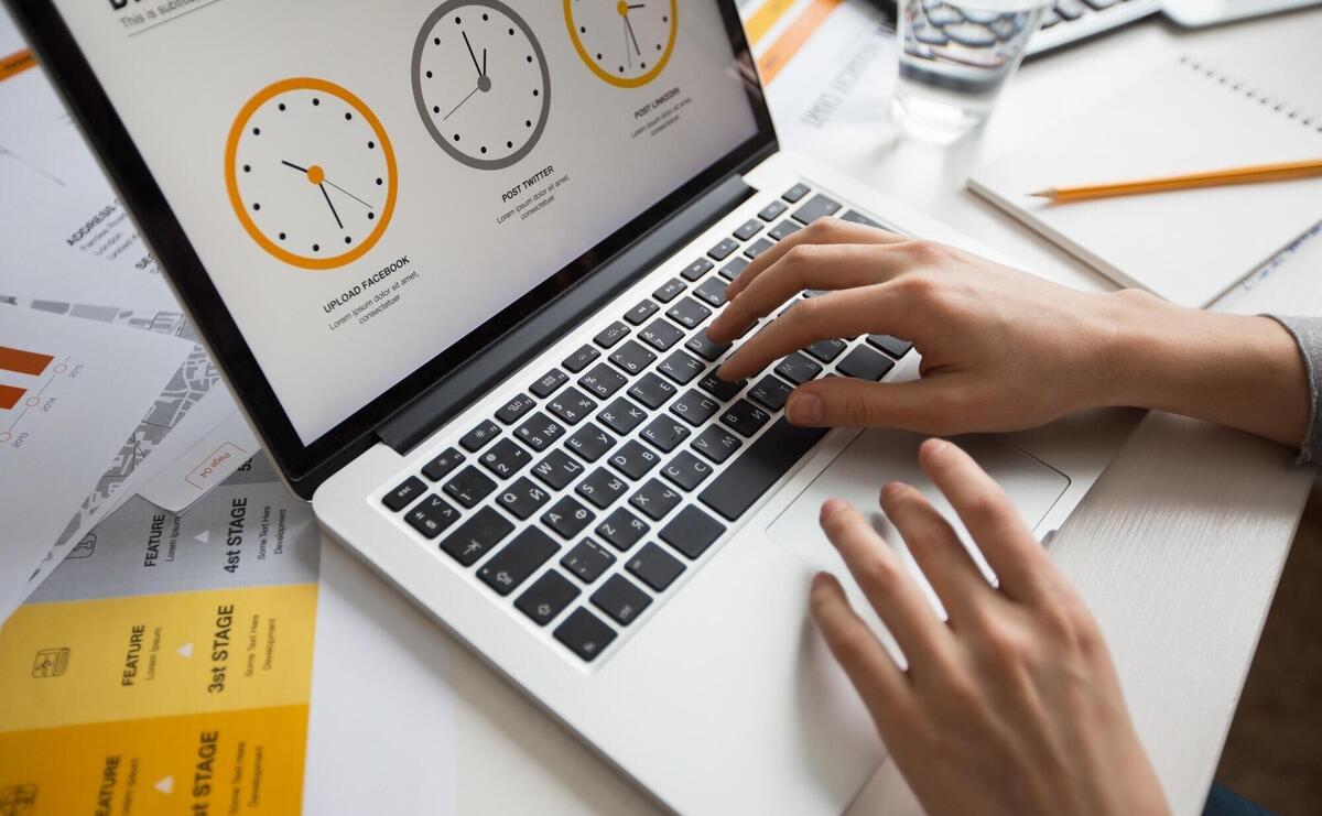 Hands of businesswoman using laptop in office